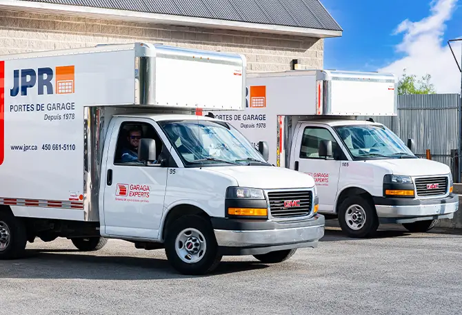 Garage door technicians in their service trucks